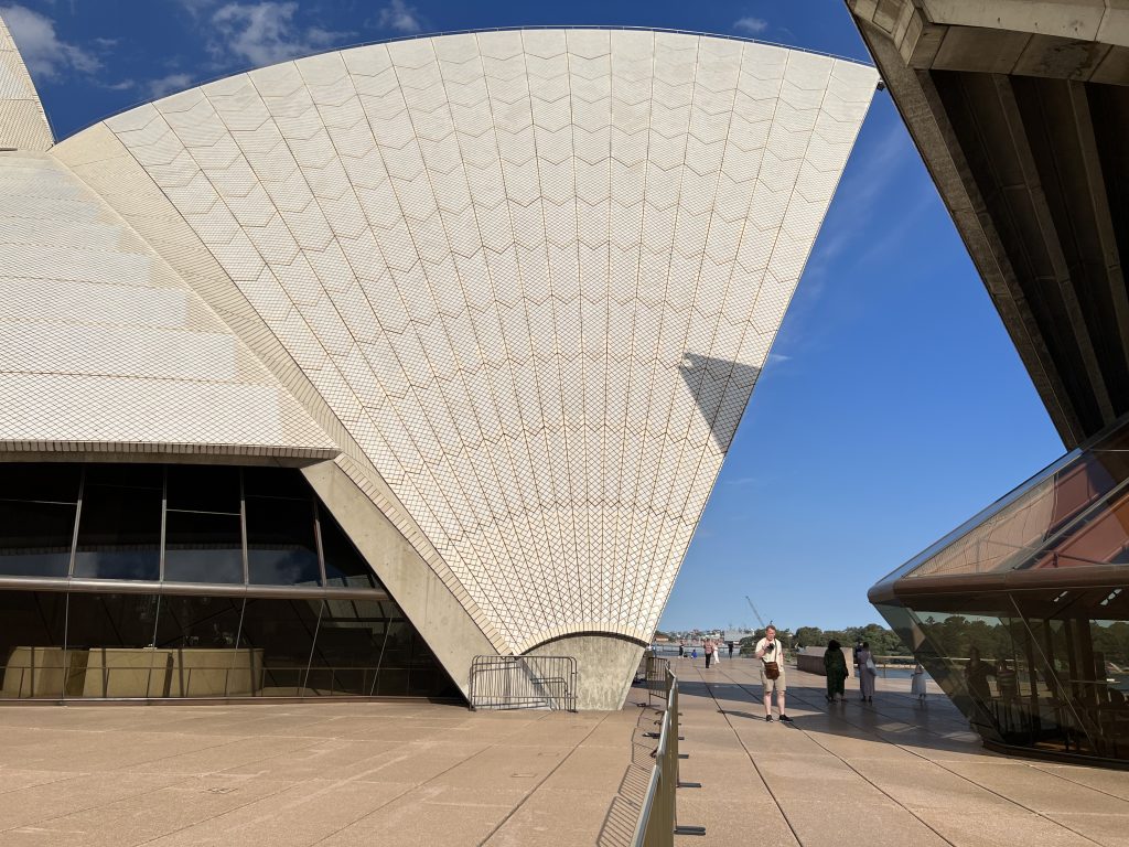 A side view of one of the buildings of the Sydney Opera House, emphasising its geometric beauty as a sector of a circle