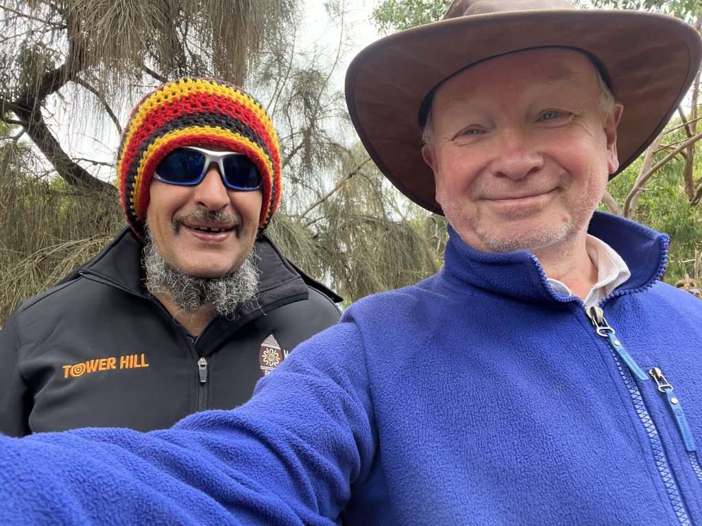 Brett Clarke, dressed in a colourful wooly hat and me with a kangaroo skin hat and blue jacket.